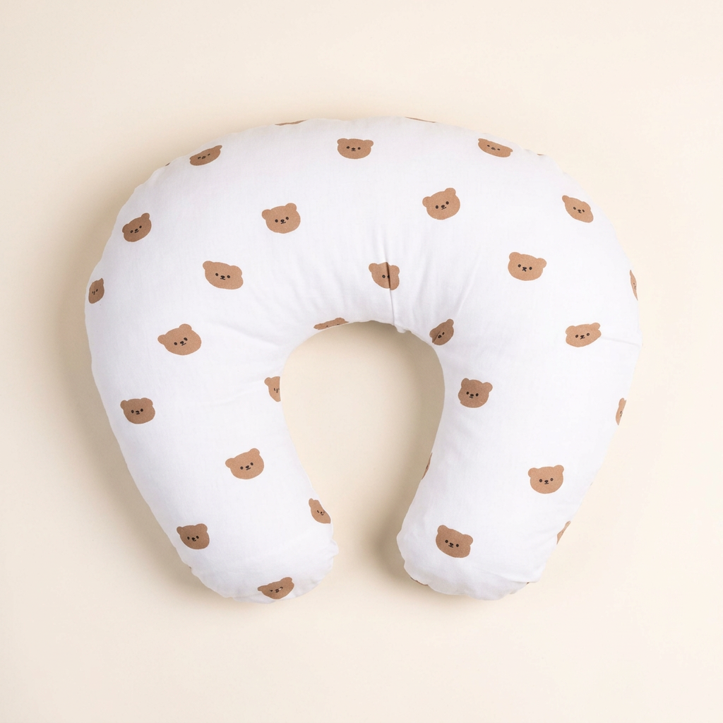 White teddy bear print feeding pillow, overhead view