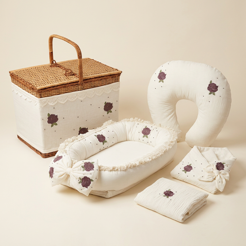 Ivory Rose five-piece baby set with basket, three-quarter view