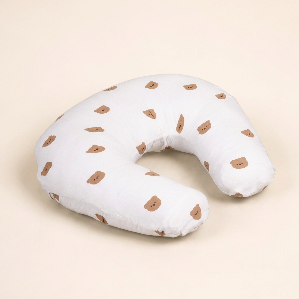 White teddy bear print feeding pillow, front three-quarter view